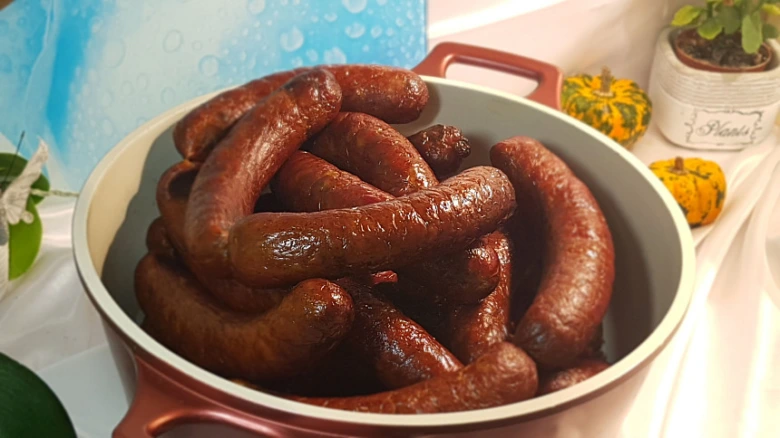 Cooked sausages in pan