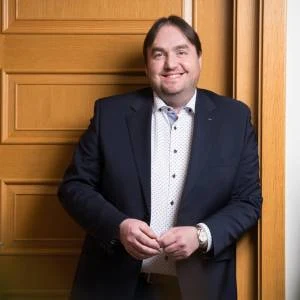 Man in suit smiling