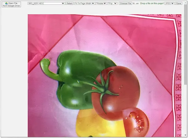 Zelený paprika s rajčetem na růžovém pozadí v okně prohlížeče obrázku.
