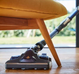 Vacuum cleaner under chair
