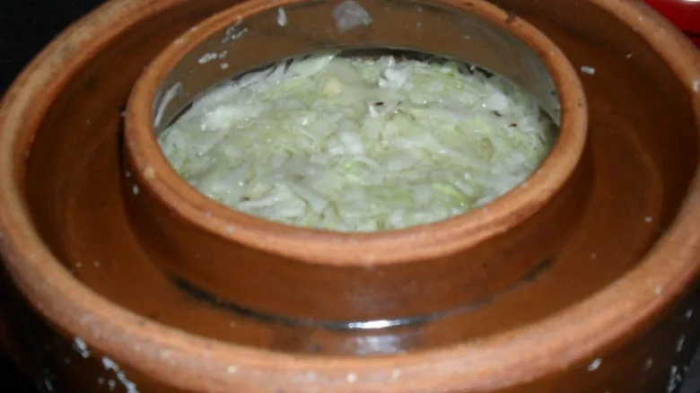 Fermenting cabbage in crock