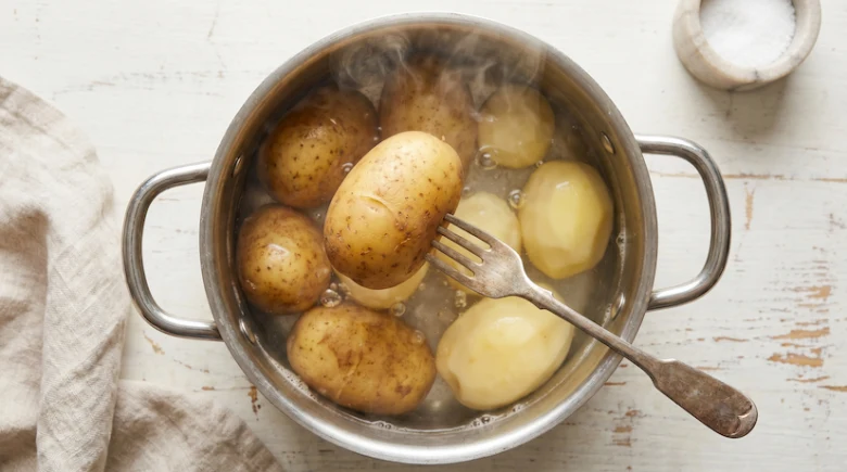 Boiling potatoes in pot